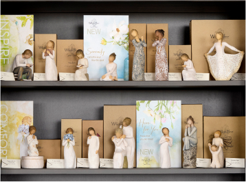 wt-wave-sign.jpg Sign that reads Capture the Moment with Willow Tree hand carved figurines setting in front