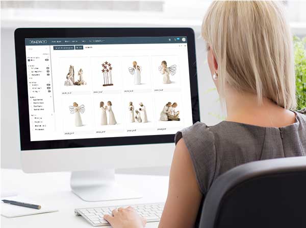 brand-connect.jpg Woman sitting at a computer browsing through images of Willow Tree products